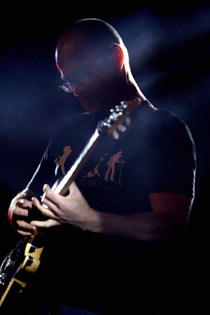 Stu playing guitar
